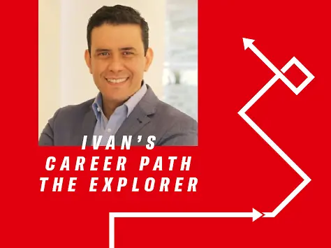 Profesional Henkel dengan latar belakang merah mengenakan kemeja biru muda dan jaket abu-abu.